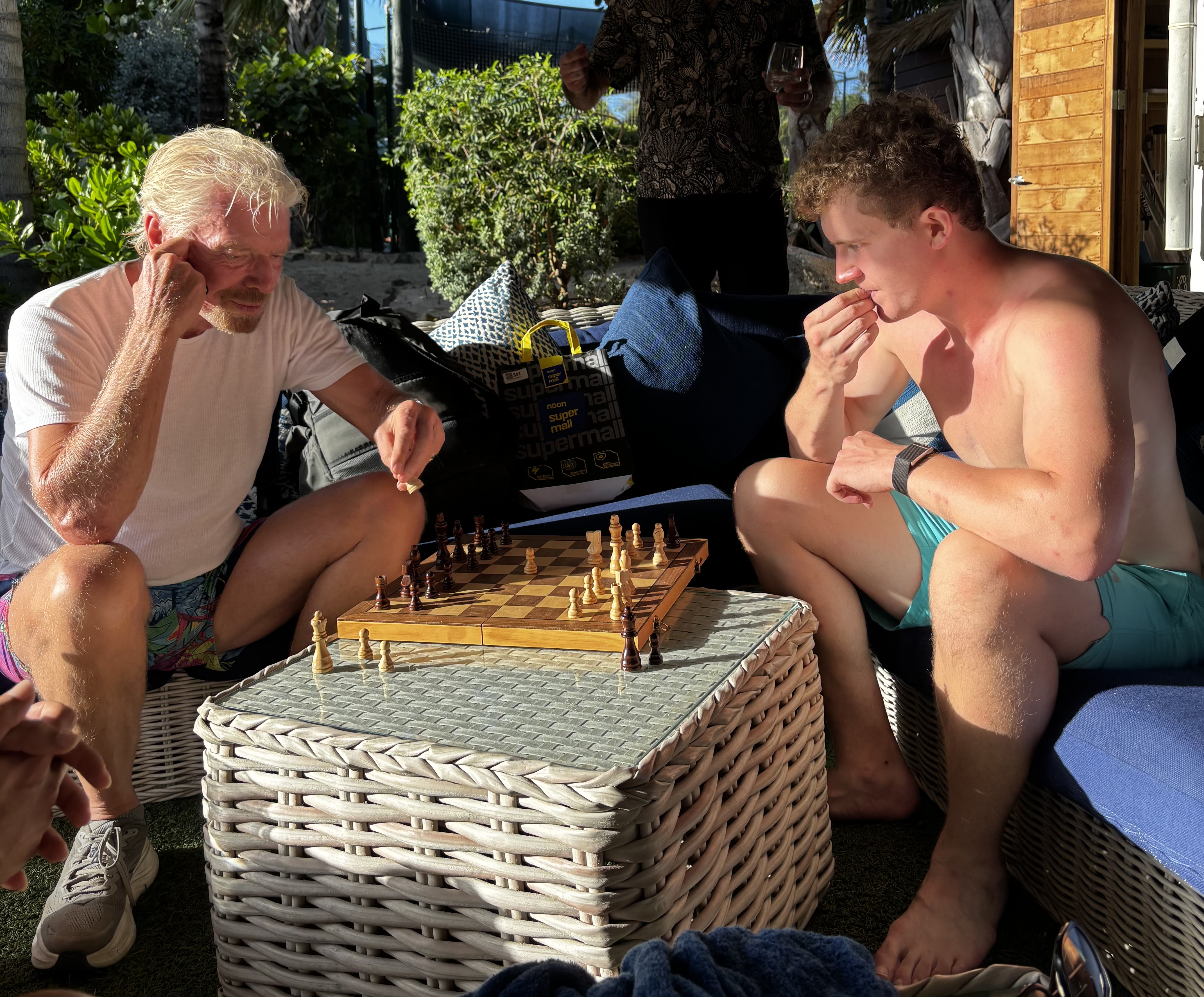 Timothy Highnam playing chess with Sir Richard Branson on Necker Island